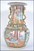 A 19th century Chinese famille rose vose having twin handled serpentine gilded embellishments to the