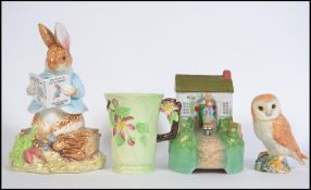 A collection of ceramics to include a Beswick eagle, Carlton Ware Art Deco beaker, Schmid musical