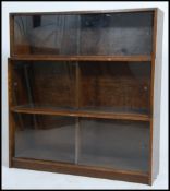 A vintage mid 20th century glazed oak three sectio