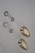 A pair of Chinese silver spoons with roundel chara