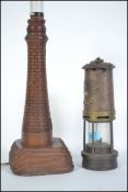 A vintage 20th century brass miners lamp by Thomas and Williams of Aberdare together with an oak