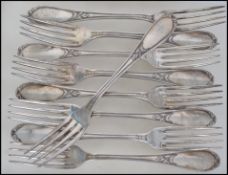 A set of 9 19th century French heavy large white metal table forks. Each marked for Ercuis OE84.