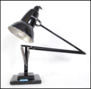 An early Herbert Terry angle poise lamp in black with a two step square base.  This particular
