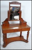A Victorian mahogany Duchess dressing table raised on turned supports having a single drawer