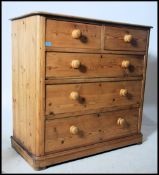 A Victorian pine 2 over 3 chest of drawers being raised on a plinth base having 2 short over 3