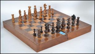 An early 20th century  large mahogany and tunbridge inlaid chess board box complete with chess