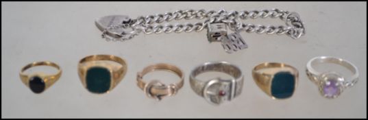 Six Silver Rings and A Silver Charm Bracelet