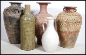A collection of large floor standing highly decorated amphora's together with a large ceramic /