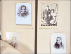 A Victorian leather embossed photograph album containing many black and white photograph studies