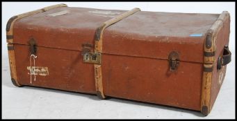 An early 20th century canvas  cane banded steamer trunk locks  and clasps to the front