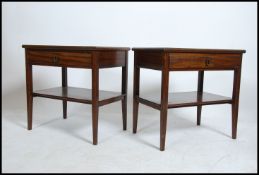 A pair of mid century mahogany bedside tables rais