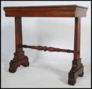 A 19th century Regency oak writing table desk rais