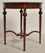 An Edwardian mahogany inlaid circular centre table. Raised on turned legs united by stretchers