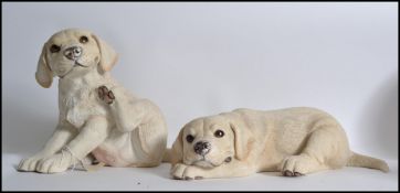 A pair of ' Puppy Love ' Labrador large puppy dogs by Country Artists.  One labelled and numbered