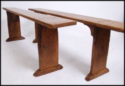 A pair of 19th century French refectory pig benche