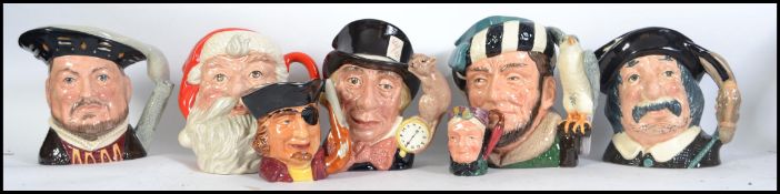 A collection of Royal Doulton ceramic Toby Jugs to include The Falconer D 6533, Mad Hatter D6598,