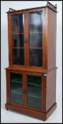 A good late 19th century Victorian solid mahogany library bookcase cabinet having twin sections with