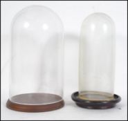 2 circa 20th century glass domes - ideal for taxidermy or clock covers along with 2 wooden plinth