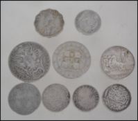 A small collection of silver coins dating from the