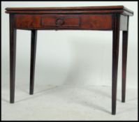 A Georgian 19th century mahogany tea / games table being raised on squared legs with frieze drawer