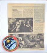 A rare set of three space travel interest autographs. An original paper label commemorating the