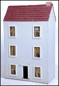 A vintage 20th century  vintage  dolls house having decorated interior ( see illustrations) front