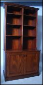 A large Regency revival mahogany breakfront  bookcase of upright form having plinth base and