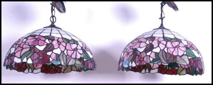 A pair of vintage 20th century Tiffany style leaded glass hanging ceiling light shades with