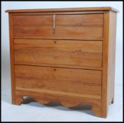 An early 20th century Edwardian walnut cottage chest of drawers. Having a run of three straight