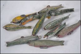 A collection of vintage mid 20th century wooden hand carved and painted fishing lures. Various