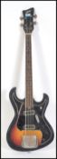A 1960's Zenta Japanese bass guitar black ground with sunburst body.