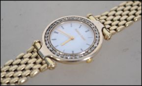 A Beuche Girod 9ct gold watch and strap with diamo