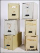 A set of 6 mid century stacking white painted metal index office industrial filing cabinets having