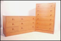 A retro 1970's natural oak finish chest of drawers by Stag. The upright chest with finger hole