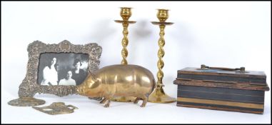 A mixed lot to include a 20th century brass pig paper weight a pair of barley twist brass candle