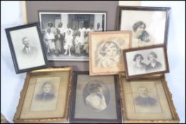 A collection of framed and glazed photographs dati