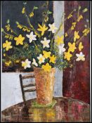 A 20th century framed still life study - painting of a vase of flowers. Flowers include daffodils,
