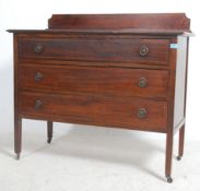 An Edwardian mahogany and satinwood inlaid chest of drawers.  3 long drawers with brass fittings and