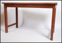 A vintage mid 20th century school science lab table / breakfast bar having solid wood top raised