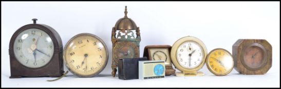 A collection of vintage 20th century clocks  and travel alarm clocks to include a Baby Ben, Sumatic,