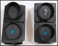 A pair of 20th century / modern Industrial traffic lights , the circular screes with hoods set to