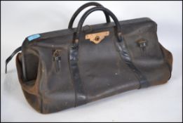 An early to mid 20th century medium sized  leather