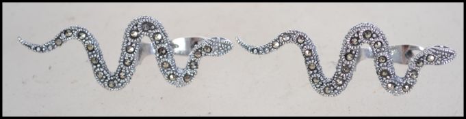 A pair of unusual silver and marcasite adorned ear