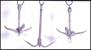 A group of three stunning  vintage /  retro folding three point boat anchors. Measures 47cm high x