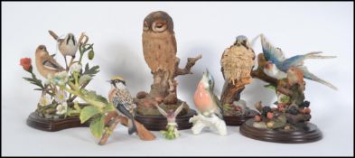 A collection of wildlife figures to include owls,