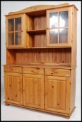A retro 1980's pine Welsh Dresser having glazed do
