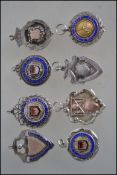 A group of 8 silver hallmarked fob medals to inclu