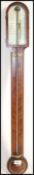 A 19th century Georgian mahogany stick barometer. The silvered barometer dial marked for Singers