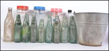 Collection of vintage and retro sweet jars and advertising glass cod bottles together with a vintage