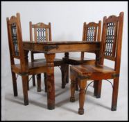 A contemporary Mexican pine dining table and 4 chairs - suite. The table and chairs raised on turned